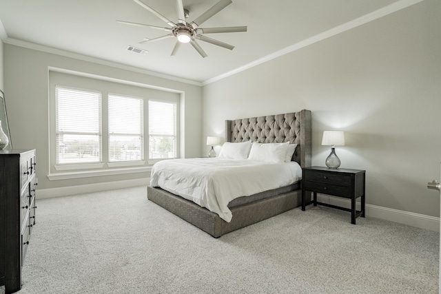 bedroom with ceiling fan, light colored carpet, and ornamental molding