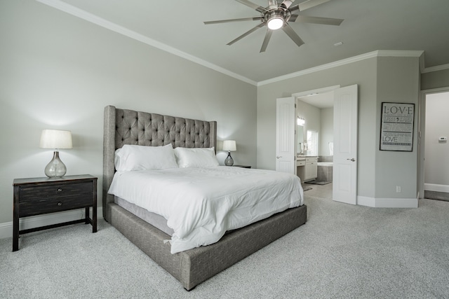 carpeted bedroom featuring connected bathroom, ceiling fan, and crown molding