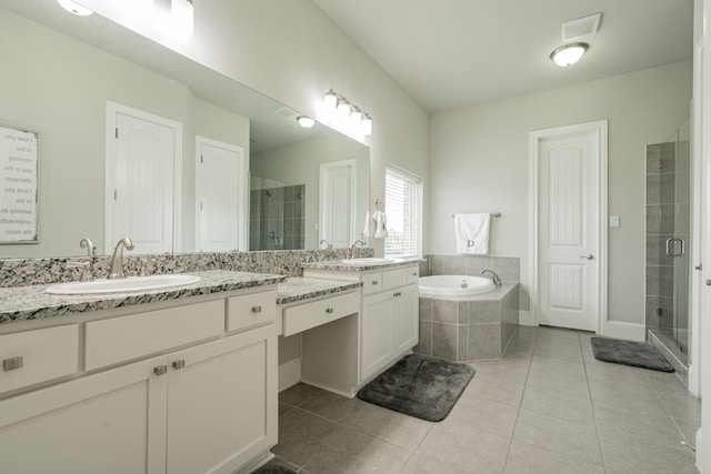 bathroom featuring tile patterned flooring, vanity, and independent shower and bath