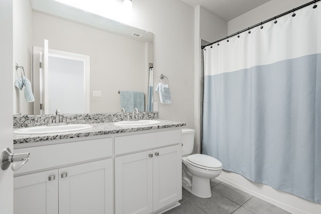 full bathroom featuring tile patterned flooring, vanity, toilet, and shower / tub combo with curtain