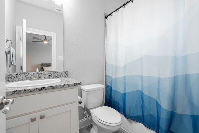 full bathroom featuring ceiling fan, toilet, vanity, and shower / tub combo