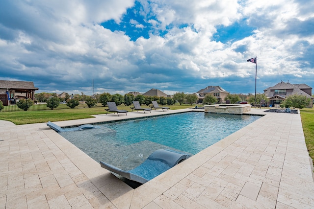 view of swimming pool with a lawn, an in ground hot tub, and a patio