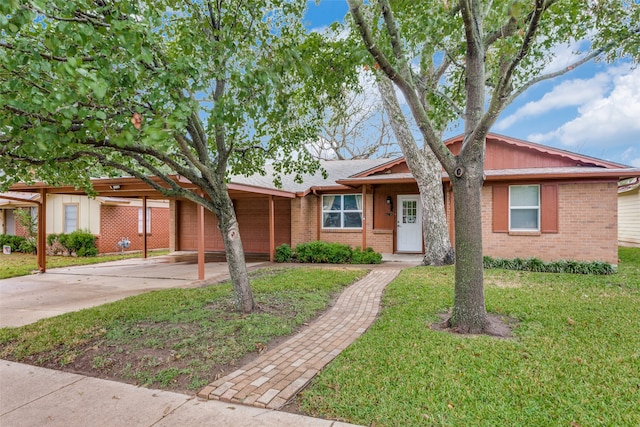 ranch-style home with a front lawn and a carport