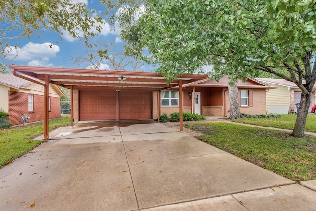 single story home featuring a garage, a carport, and a front lawn