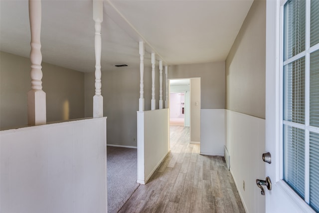 hall with light hardwood / wood-style floors