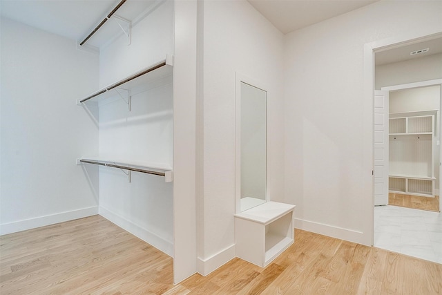 spacious closet with visible vents and light wood-type flooring