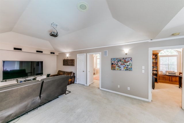 living room featuring light carpet and vaulted ceiling