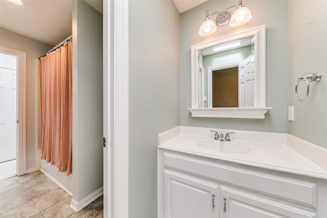 bathroom featuring tile patterned flooring and vanity