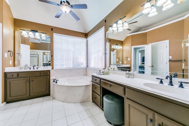 bathroom featuring vanity, lofted ceiling, a tub, and tile patterned floors