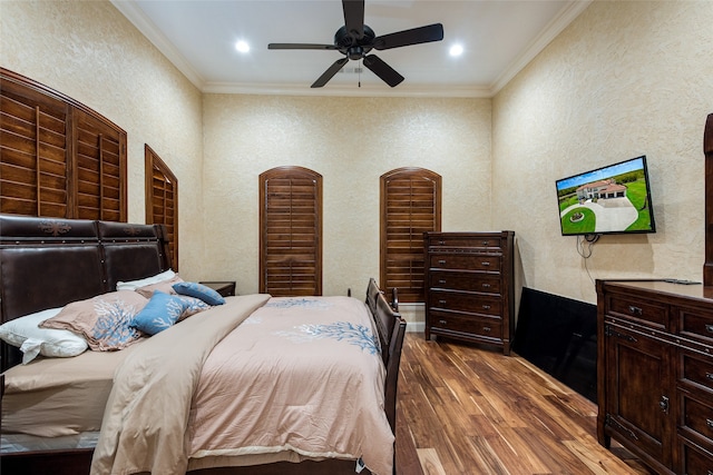 unfurnished bedroom featuring ceiling fan, dark carpet, and ornamental molding