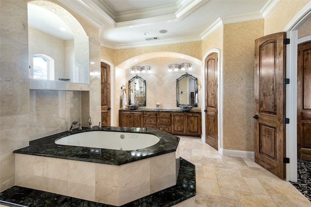 bathroom with tiled shower and crown molding