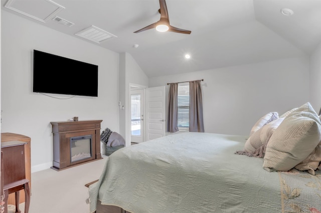 carpeted bedroom with ceiling fan and lofted ceiling