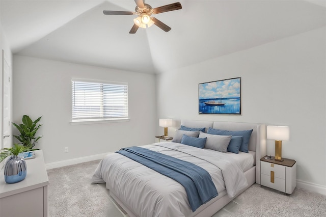 carpeted bedroom with ceiling fan and lofted ceiling