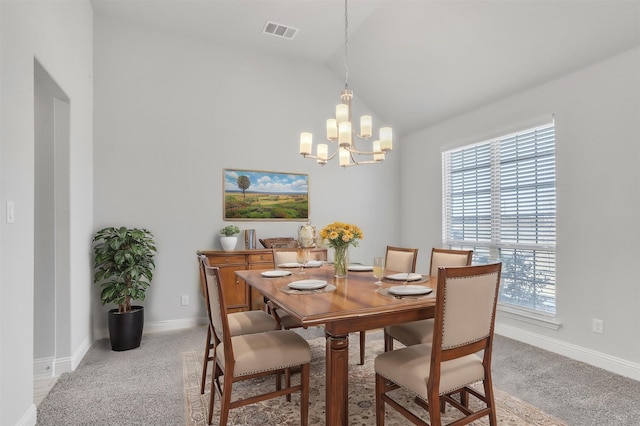 carpeted dining area featuring vaulted ceiling and a notable chandelier