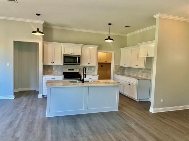 kitchen featuring white cabinetry, appliances with stainless steel finishes, hanging light fixtures, and light hardwood / wood-style floors