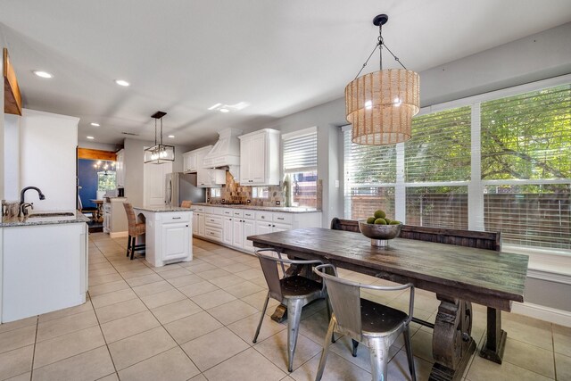 living room featuring dark hardwood / wood-style flooring, ceiling fan, and a high ceiling