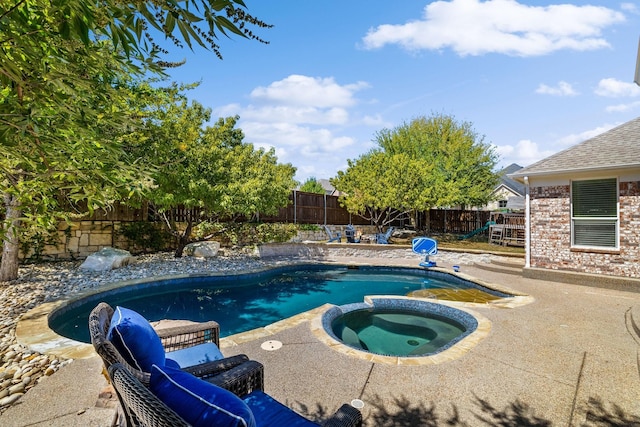 view of swimming pool featuring an in ground hot tub, a patio area, a fenced backyard, and a fenced in pool