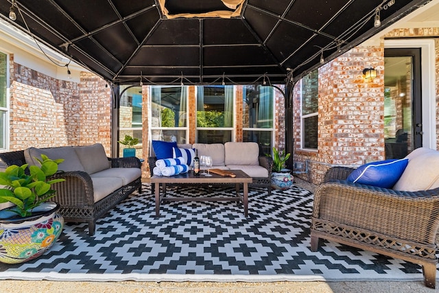 view of patio / terrace with outdoor lounge area and a gazebo