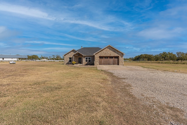 view of front of home featuring a garage and a front lawn