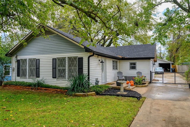 view of front of house with a garage and a front yard