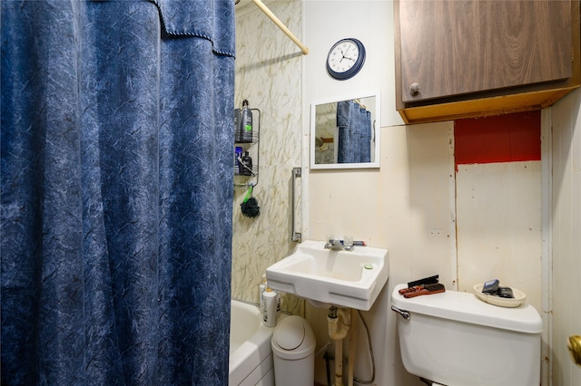 full bathroom with toilet, shower / bath combo, and sink