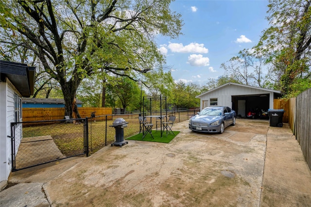 view of yard with an outbuilding and a garage