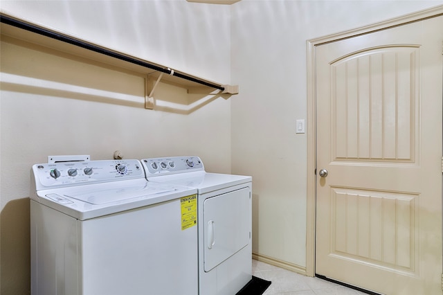 laundry room featuring separate washer and dryer