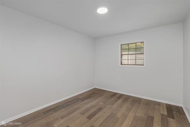 empty room with hardwood / wood-style flooring