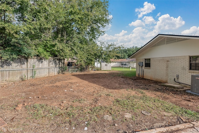 view of yard featuring central AC unit