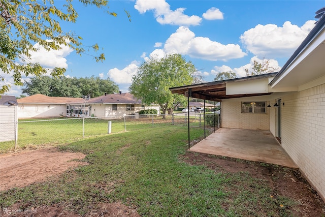 view of yard featuring a patio and a carport