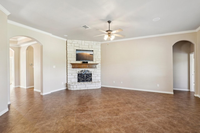 unfurnished living room with crown molding, a fireplace, and ceiling fan