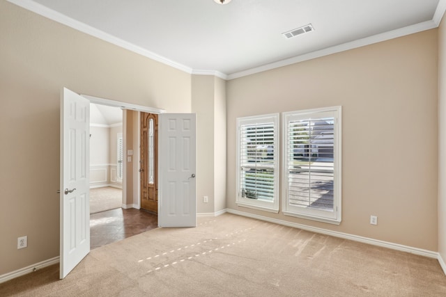 unfurnished bedroom featuring light carpet and ornamental molding