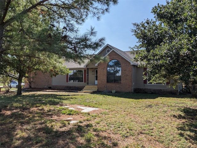 view of front of property with a front lawn