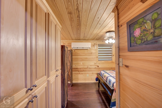 bedroom featuring dark wood-type flooring, wood ceiling, wood walls, ceiling fan, and an AC wall unit