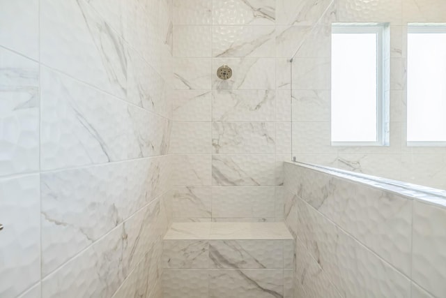 bathroom with a tile shower