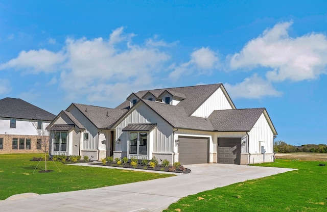 modern inspired farmhouse with a garage and a front yard