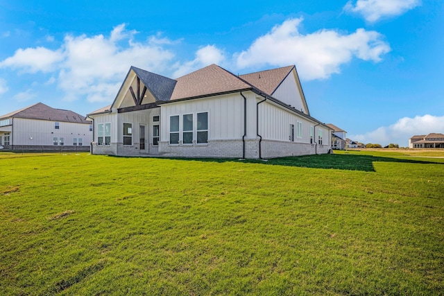 back of house with a yard