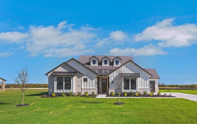 modern inspired farmhouse with a front yard