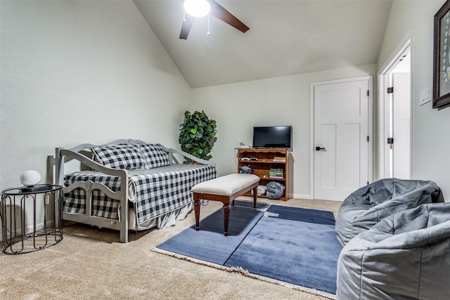 bedroom with ceiling fan, light colored carpet, and vaulted ceiling