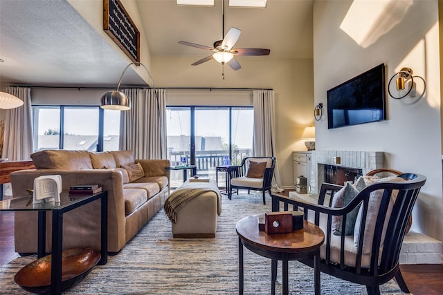 living room featuring vaulted ceiling, ceiling fan, sink, and dark hardwood / wood-style floors