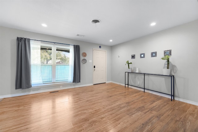 foyer entrance with light hardwood / wood-style floors