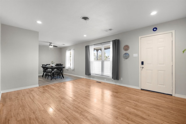 entryway with light hardwood / wood-style floors and ceiling fan