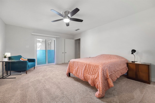 carpeted bedroom featuring ceiling fan and access to exterior