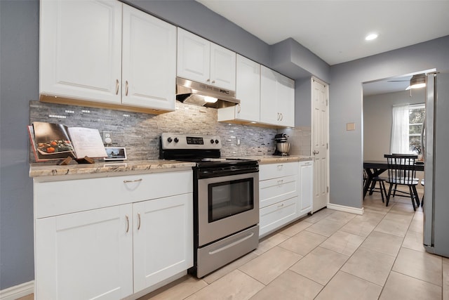 kitchen with tasteful backsplash, white cabinetry, appliances with stainless steel finishes, and light tile patterned floors