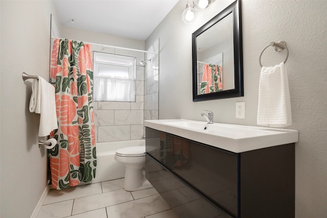 full bathroom with vanity, tile patterned floors, toilet, and shower / tub combo