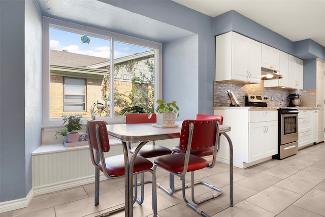 dining space with light tile patterned flooring