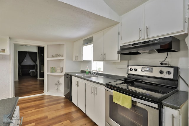 kitchen featuring white cabinetry, light hardwood / wood-style floors, sink, and stainless steel range with electric cooktop