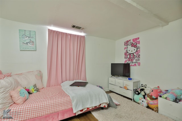 bedroom featuring hardwood / wood-style floors