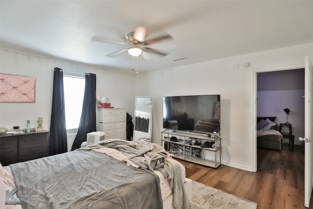 bedroom featuring dark wood-type flooring and ceiling fan