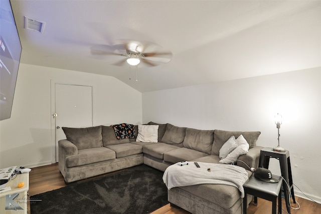 living room featuring dark wood-type flooring, lofted ceiling, and ceiling fan